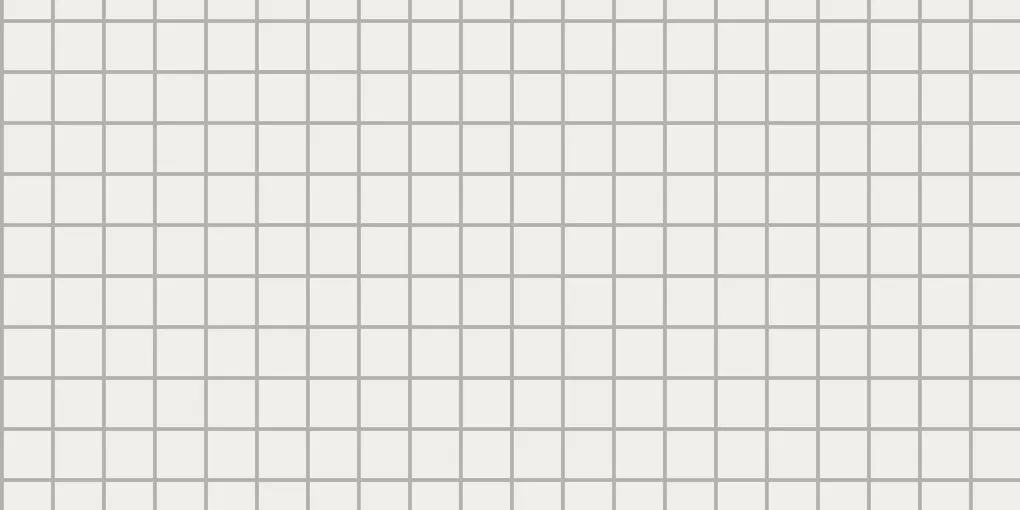 White bathroom tile with gray grout lines around a bathtub caulking seam