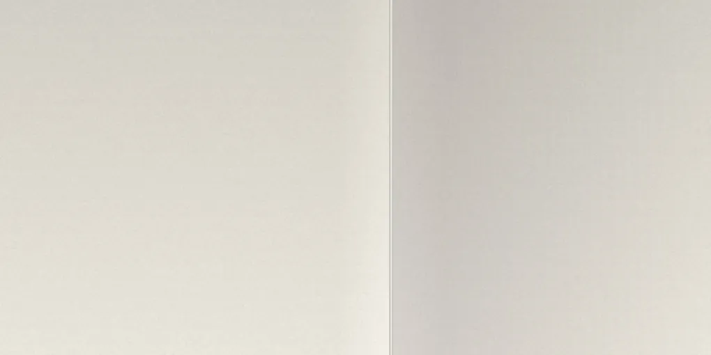 Drywall wall corner with metal corner bead where two wall surfaces meet