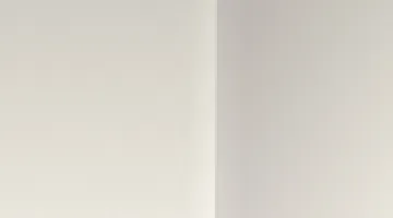 Drywall wall corner with metal corner bead where two wall surfaces meet
