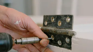 Metal door hinge with visible pin, how to fix a squeaky door