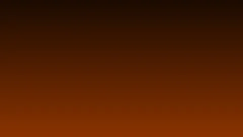 Residential gas furnace burner glowing orange in a home basement utility room