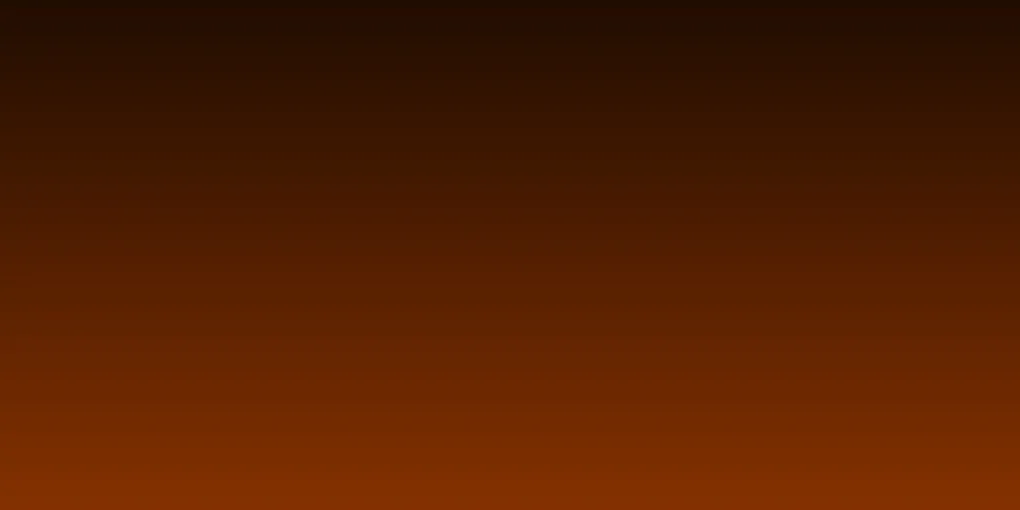 Residential gas furnace burner glowing orange in a home basement utility room