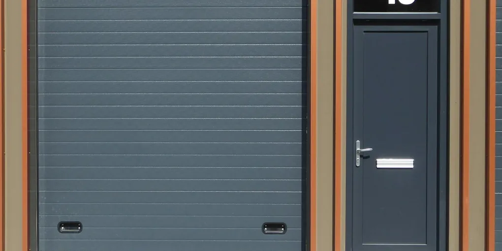 White garage door on a suburban home in afternoon light, garage door wont close fix