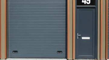 White garage door on a suburban home in afternoon light, garage door wont close fix