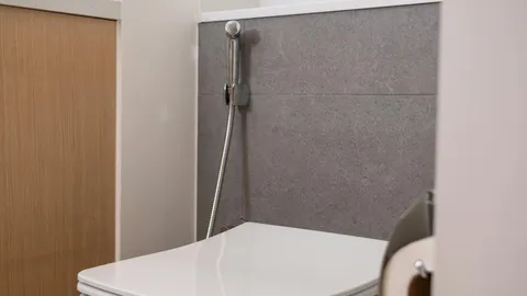 White toilet in a tiled bathroom, why is my toilet gurgling diagnostic guide