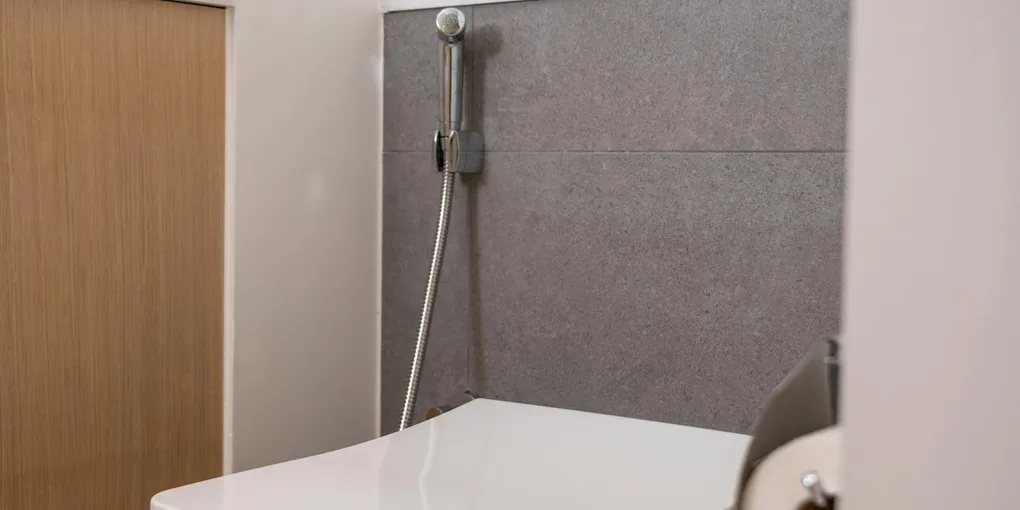 White toilet in a tiled bathroom, why is my toilet gurgling diagnostic guide