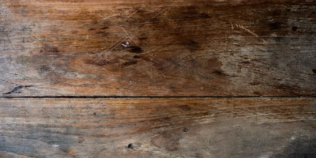 Wood floor planks with visible scratch marks, how to repair a scratch in hardwood floor