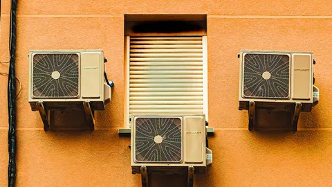 Outdoor central air conditioner condenser unit beside a residential home, HVAC troubleshooting guide