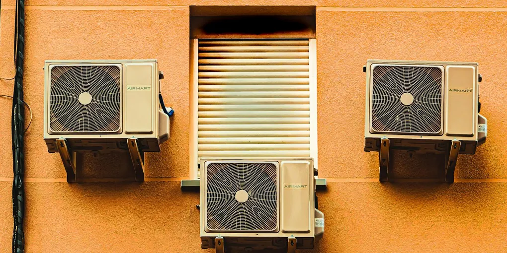 Outdoor central air conditioner condenser unit beside a residential home, HVAC troubleshooting guide