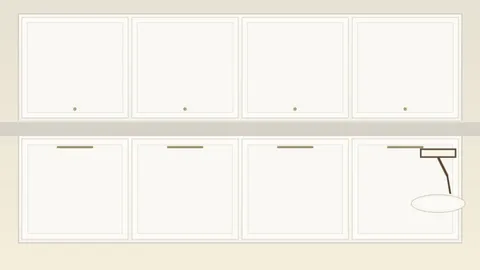 Freshly painted cream kitchen cabinets with paint roller and brush on counter