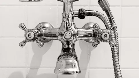 Chrome shower mixer valve with cross handles on tile, how to remove a stuck shower cartridge