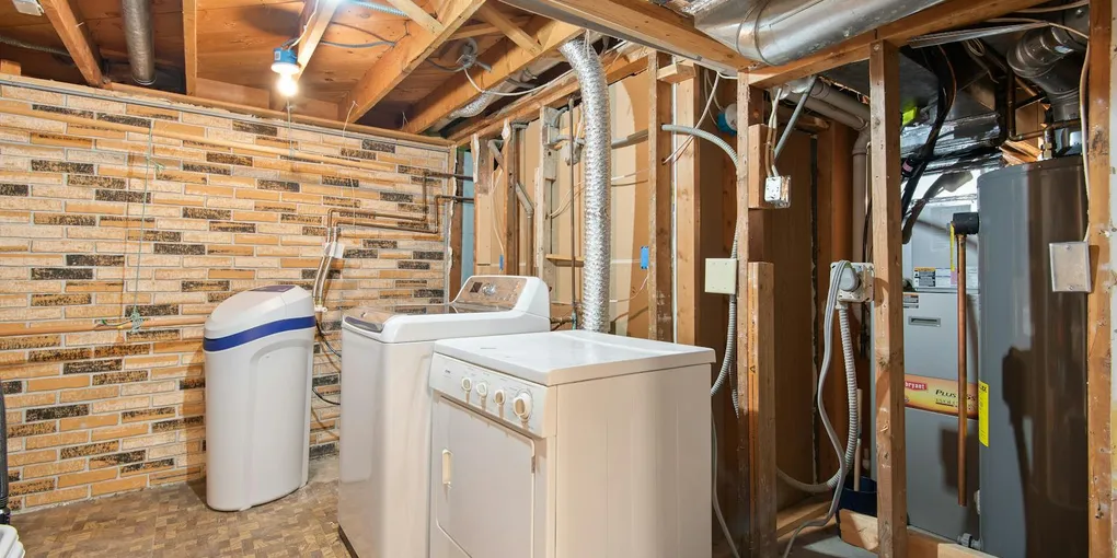 Residential water heater in a basement utility area, anode rod and gas leak diagnostic