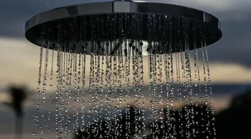 Shower head with weak water flow streaming down, why is my water pressure low
